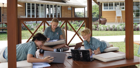 Genius School — warm classroom with books